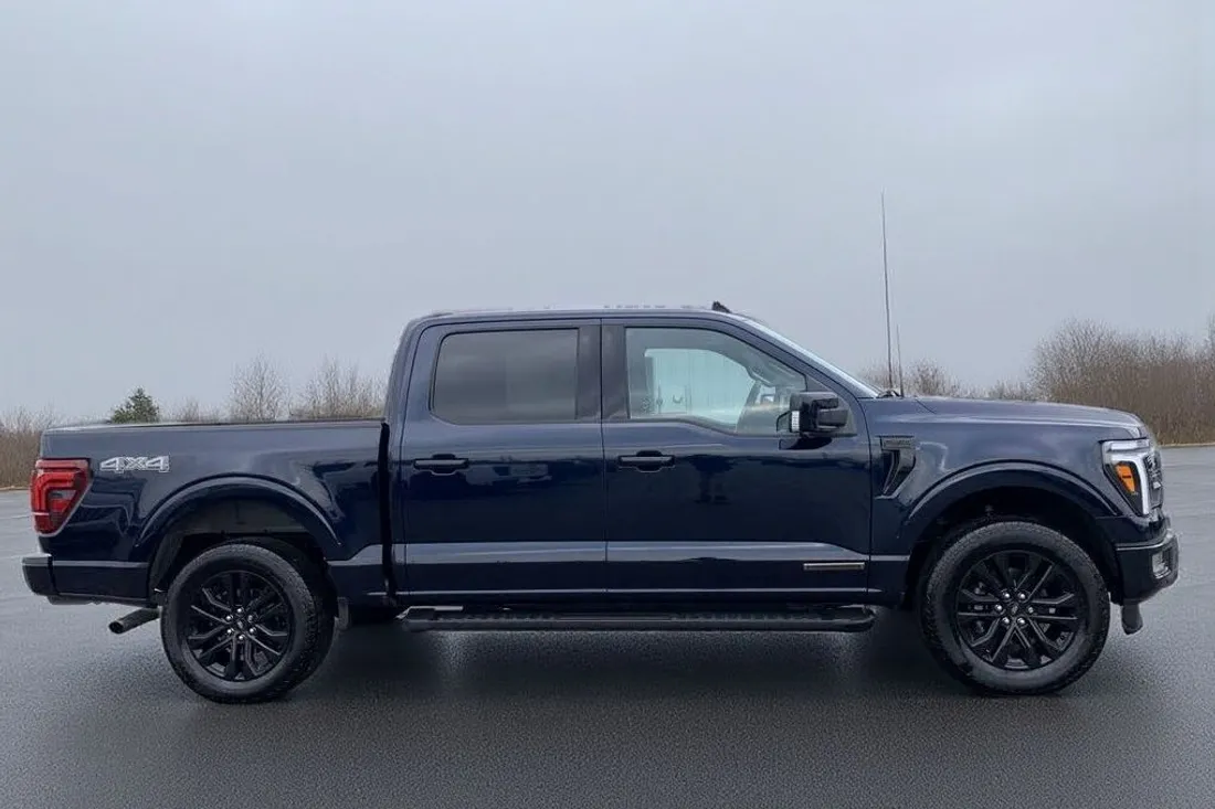 The same Ford F-150 with the dealership building replaced by a clean open lot by AutoLander’s AI Photo Studio