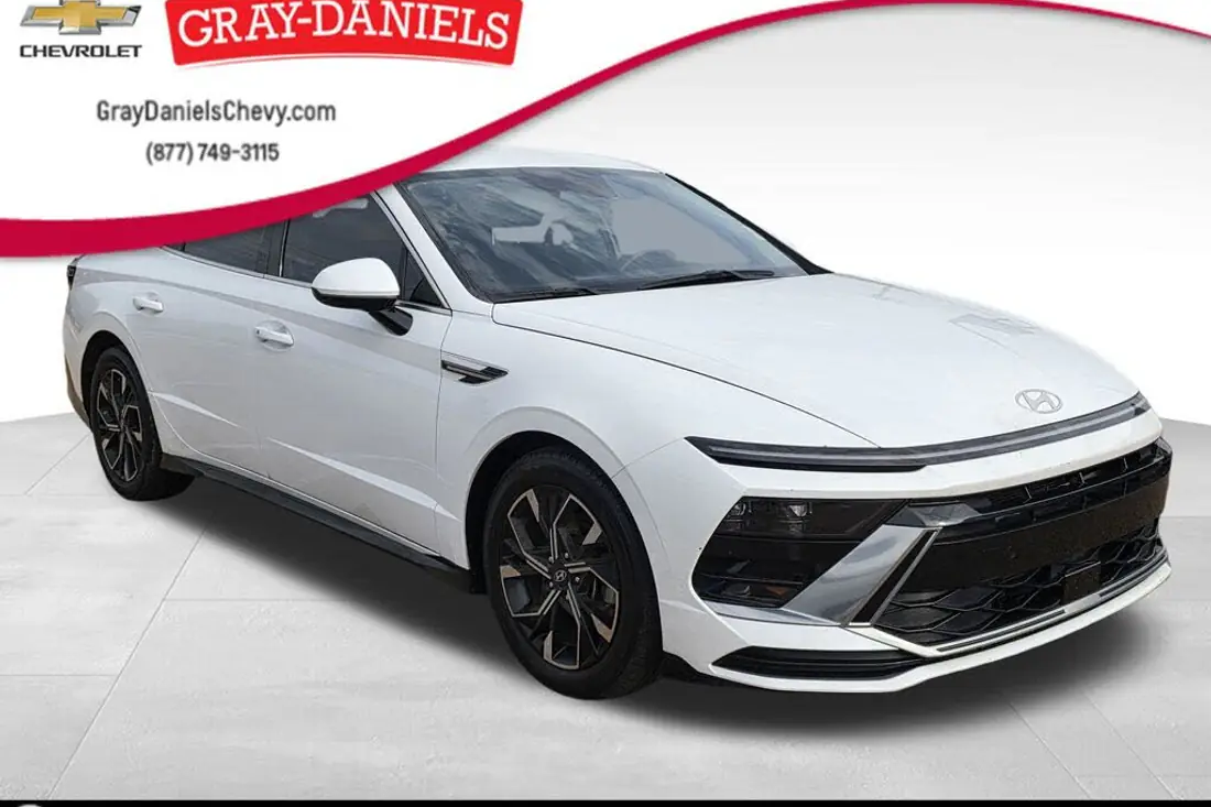 Raw dealership lot photo of a 2024 Hyundai Sonata before AutoLander