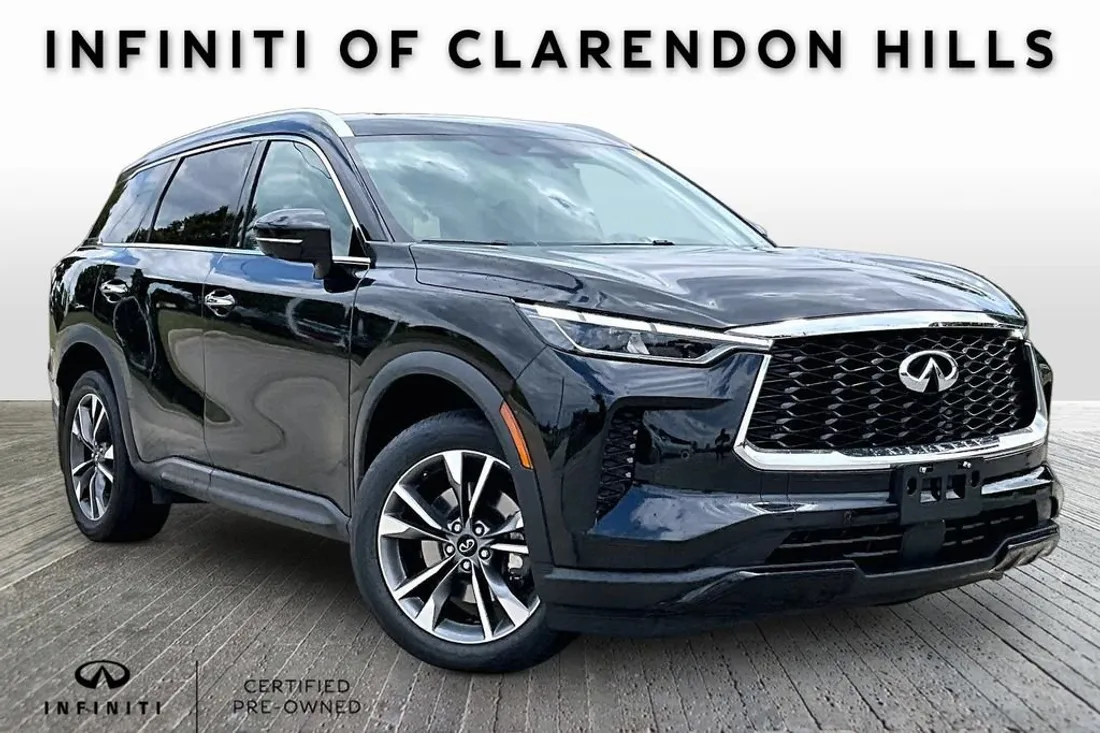 Dealer feed photo of a 2023 Infiniti QX60 with a branded promo frame, before AutoLander
