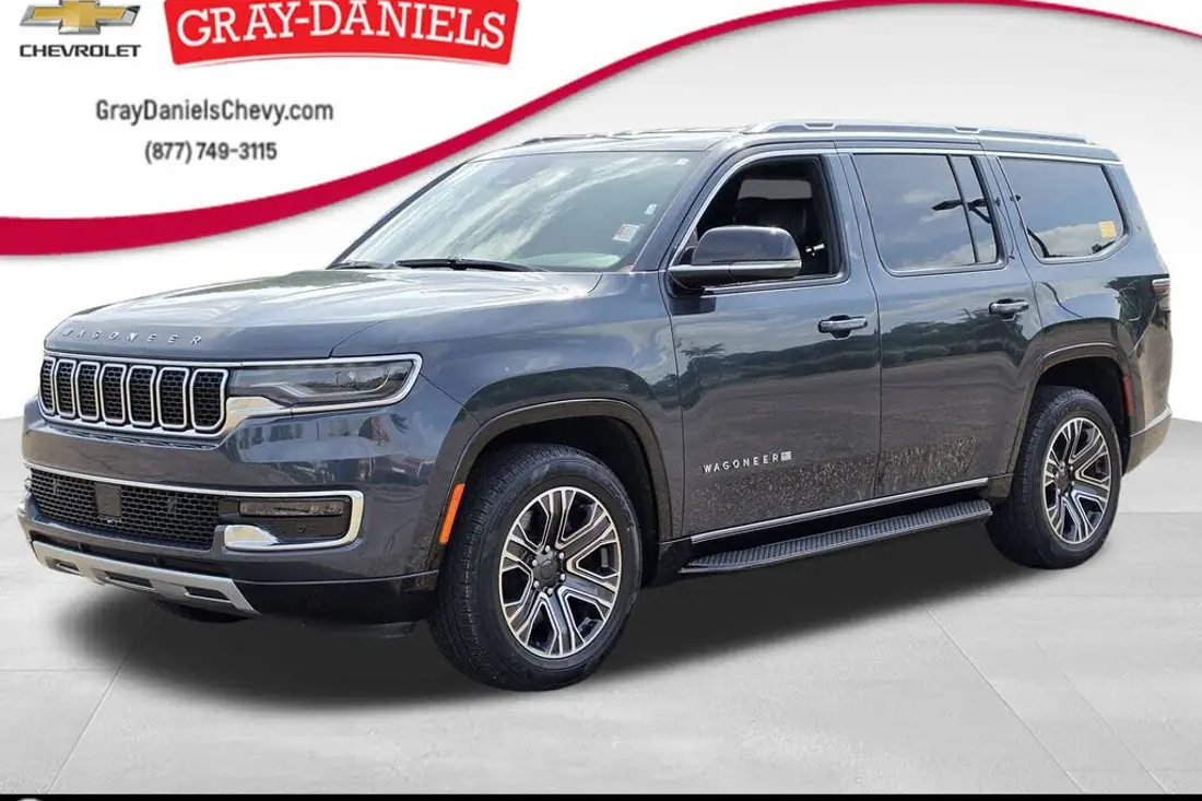 Raw dealership lot photo of a 2024 Jeep Wagoneer before AutoLander