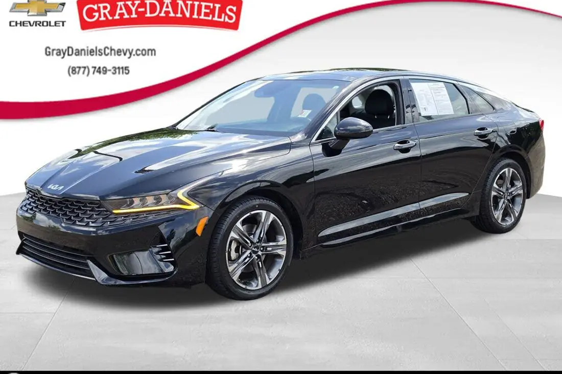 Raw dealership lot photo of a 2022 Kia K5 before AutoLander