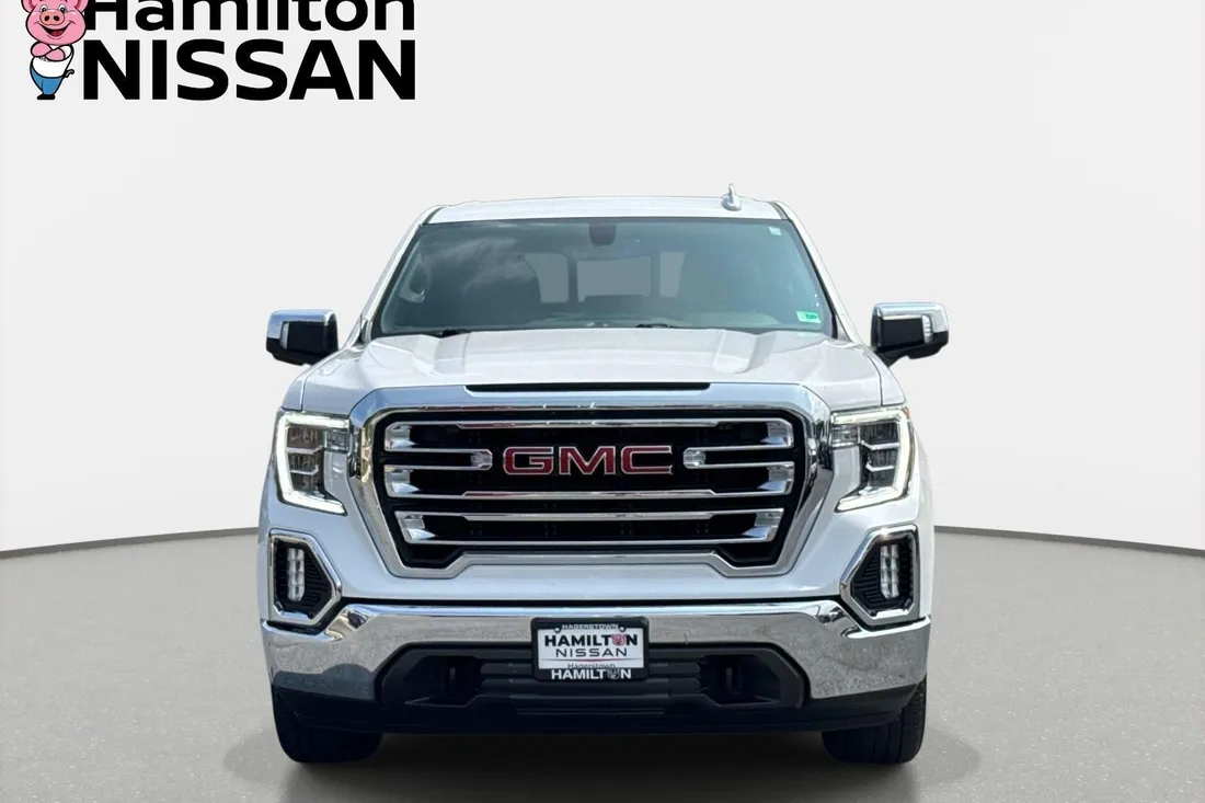 White frost tricoat 2022 GMC Sierra 1500 Limited SLT crew cab pickup in a straight-on front view, original photo before AutoLander photo editing