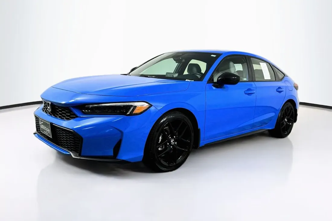 Blue 2025 Honda Civic Hybrid Sport hatchback in a front three-quarter view, original photo before AutoLander photo editing