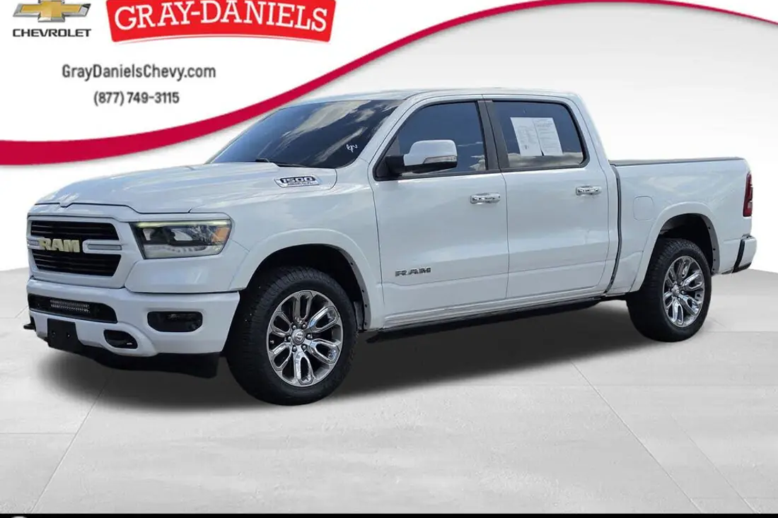 Raw dealership lot photo of a 2021 Ram 1500 before AutoLander